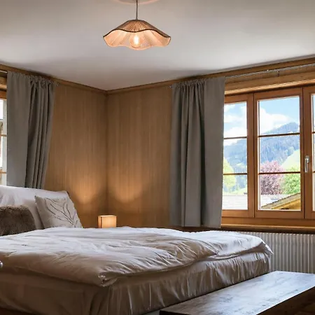 Апартаменты Cozy Alpine Retreat With Mountain View Гштад